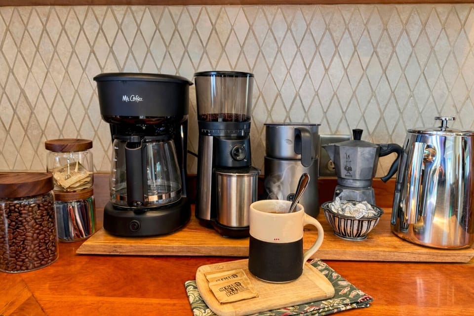 Barista-worthy coffee bar with grinder, kettle, moka pot & frother