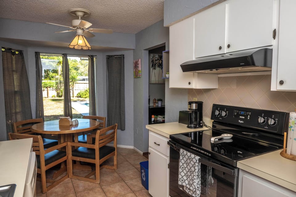 Fully loaded kitchen with breakfast nook looking out to the backyard.
