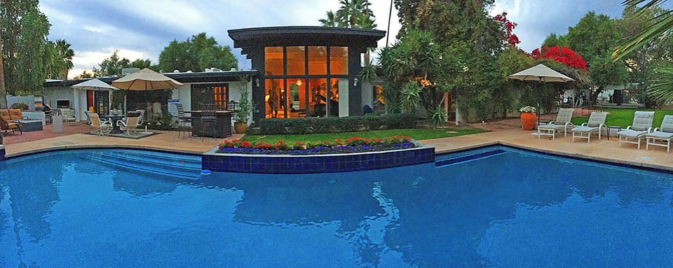 The breadth of the 1/2 acre backyard featuring the 36,000 gallon,  swimming pool