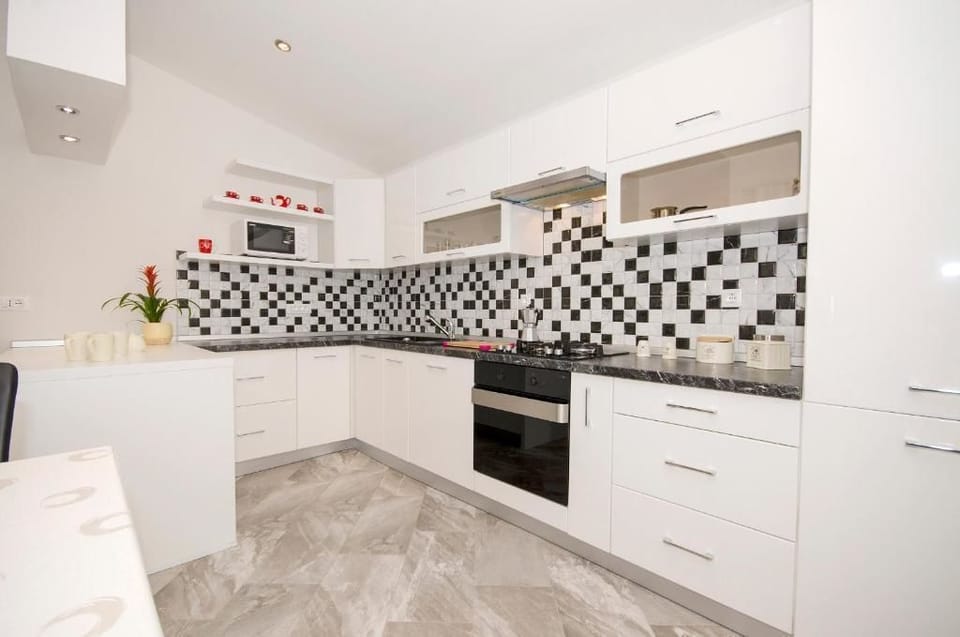 Apartment, 2 Bedrooms, Balcony, Sea View | Private kitchen | Fridge, coffee/tea maker, electric kettle