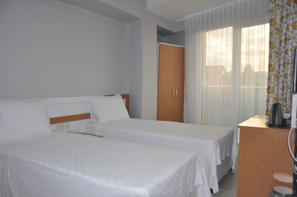 Standard Twin Room, 2 Twin Beds, Balcony | In-room safe, desk, free WiFi