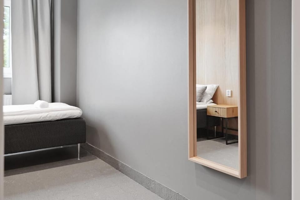 Standard Single Room, 1 Twin Bed, Shared Bathroom | Blackout drapes, soundproofing, WiFi (free), bed sheets