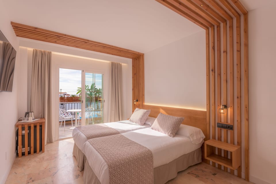 Deluxe Double Room, Terrace, Pool View | Frette Italian sheets, premium bedding, down comforters, minibar