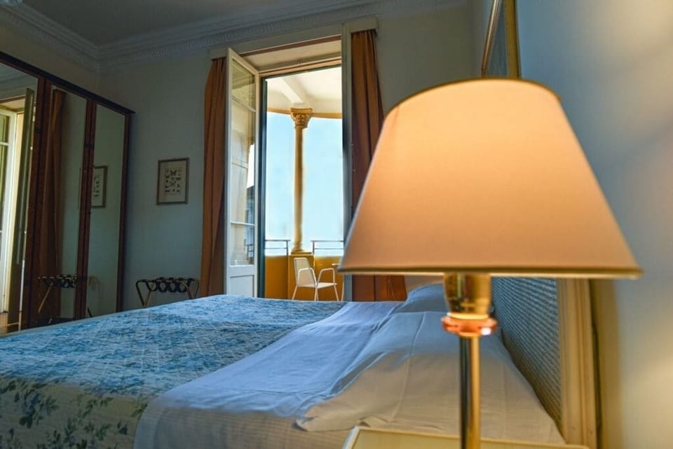 Tripla balcone | Minibar, in-room safe, individually decorated, desk