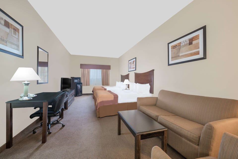 Desk, laptop workspace, blackout drapes, iron/ironing board