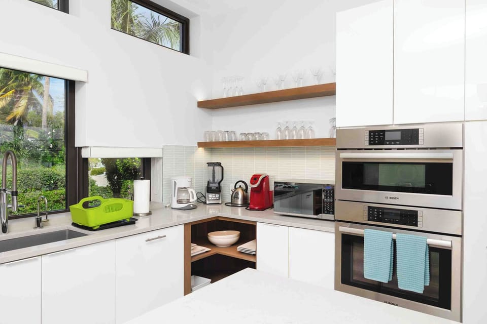 Modern countertop appliances include a drip coffee maker, blender, and electric kettle. 
