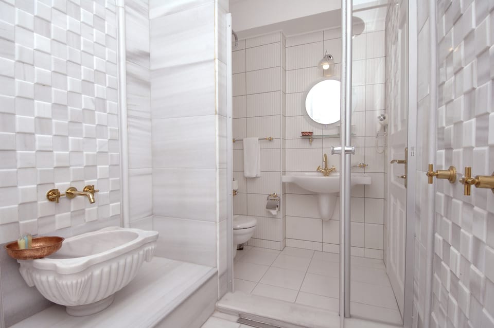 Shower, free toiletries, hair dryer, slippers