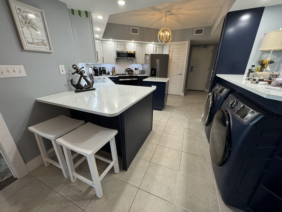 The newly remodeled Coast Kitchen features extended quartz counter tops for extra space and eating area for two.