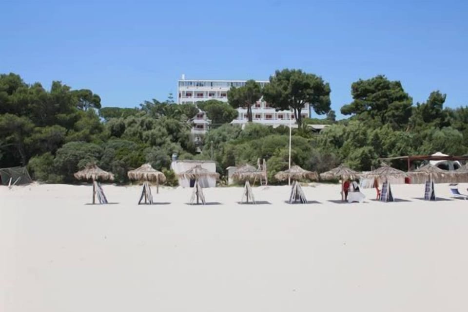 Private beach, white sand, sun loungers, beach umbrellas
