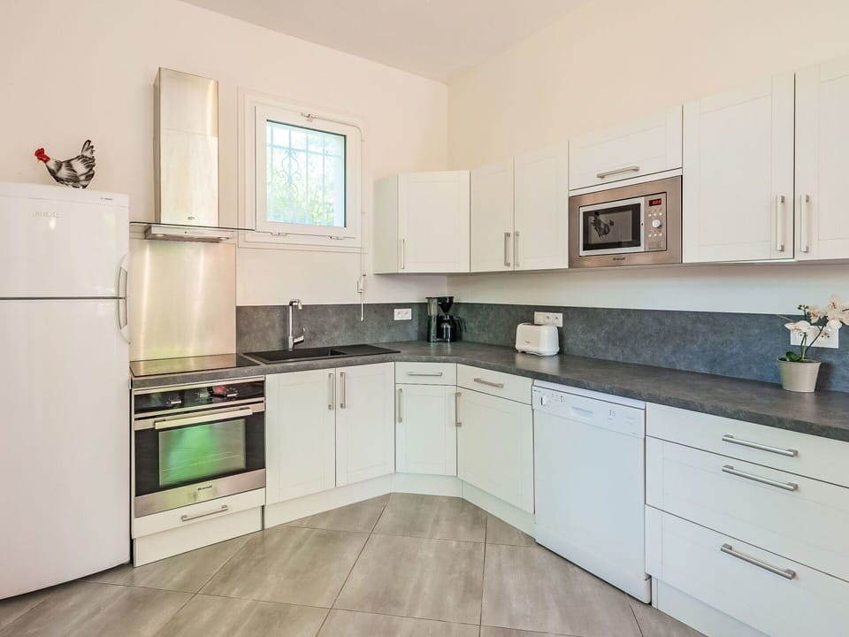 Cabinetry, Countertop, Property, Sink, Kitchen Sink, Tap, Kitchen Appliance, Kitchen Stove, Kitchen, Wood