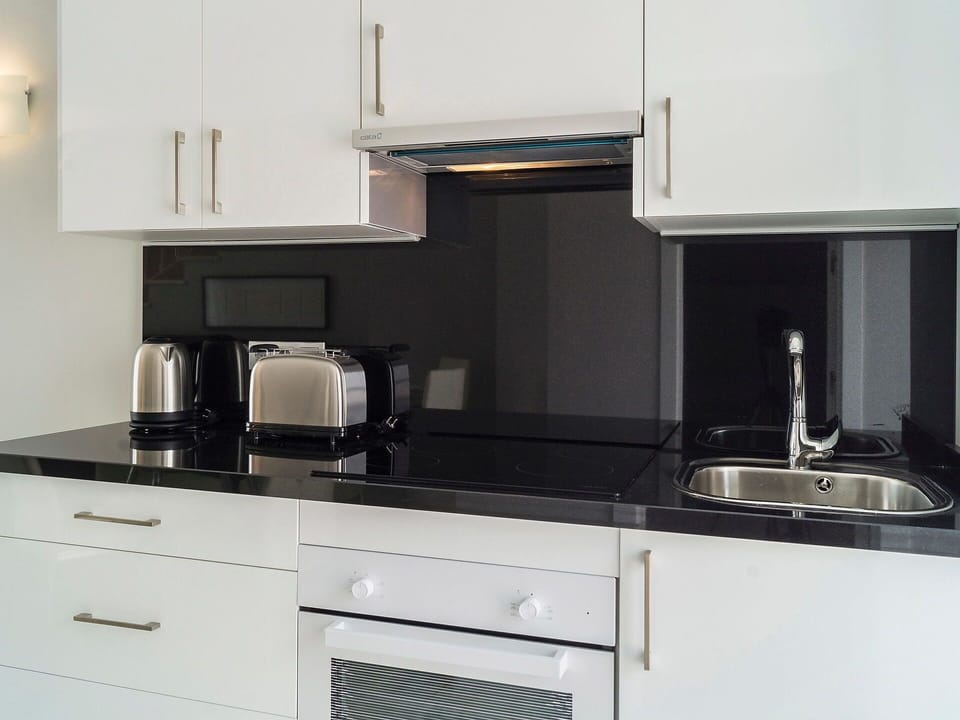 Countertop, Kitchen, Cabinetry, Room, Furniture, Property, Kitchen Stove, Kitchen Appliance, Sink, Major Appliance