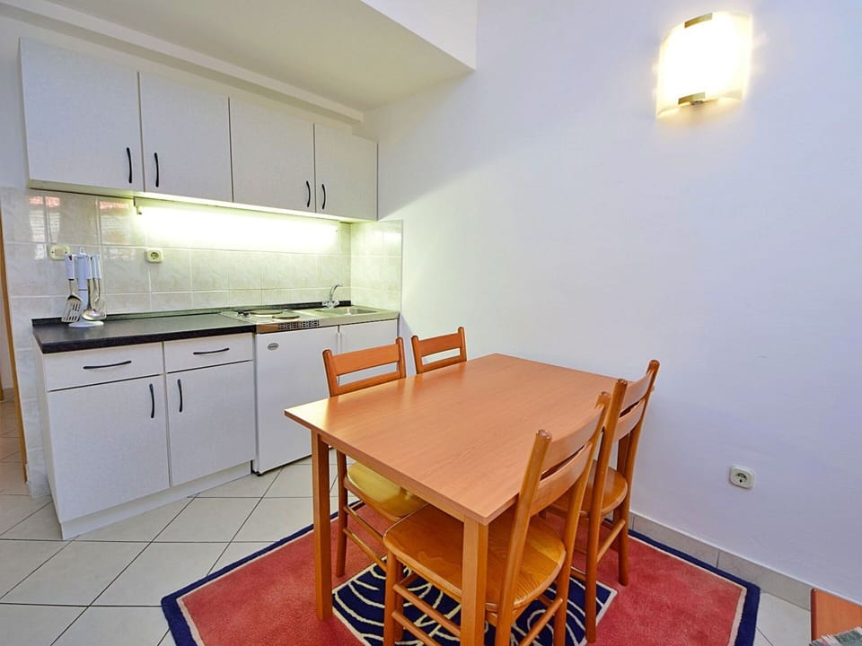 Furniture, Cabinetry, Property, Countertop, Table, Chair, Wood, Interior Design, Sink, Kitchen Stove