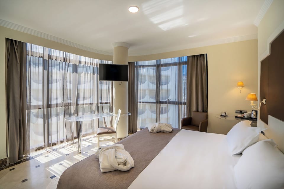 Superior Double Room, Sea View | 1 bedroom, down comforters, minibar, in-room safe