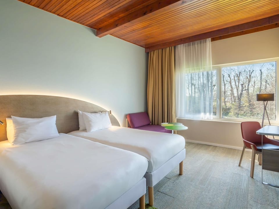 Premium bedding, blackout drapes, soundproofing, iron/ironing board