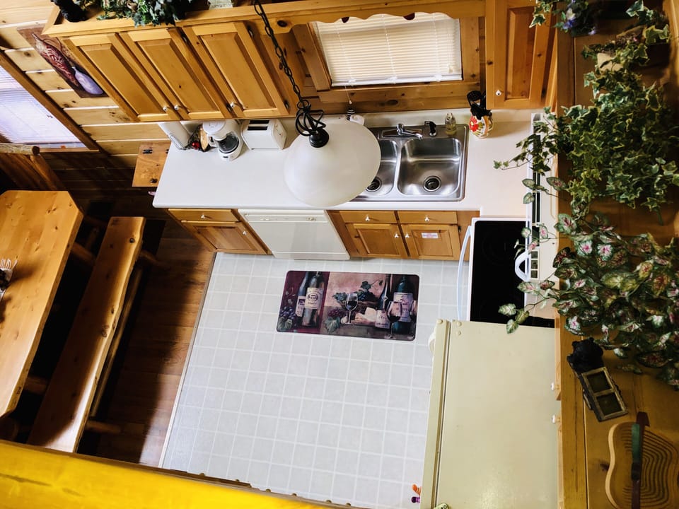 View from upstairs looking over into kitchen area.