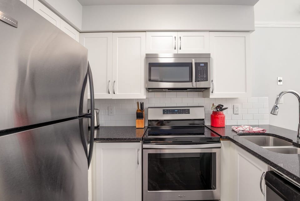 Fully equipped kitchen with granite counters & stainless steel appliances