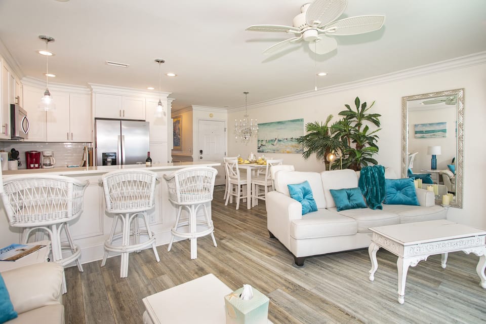 Enter into the Bright Open Concept Living/Kitchen/Dining Areas from the of deck