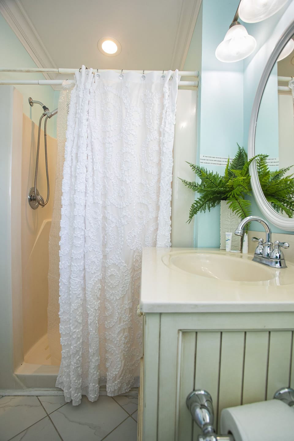 En suite - hand held shower, can lighting, wifi speaker (download the app Broan)