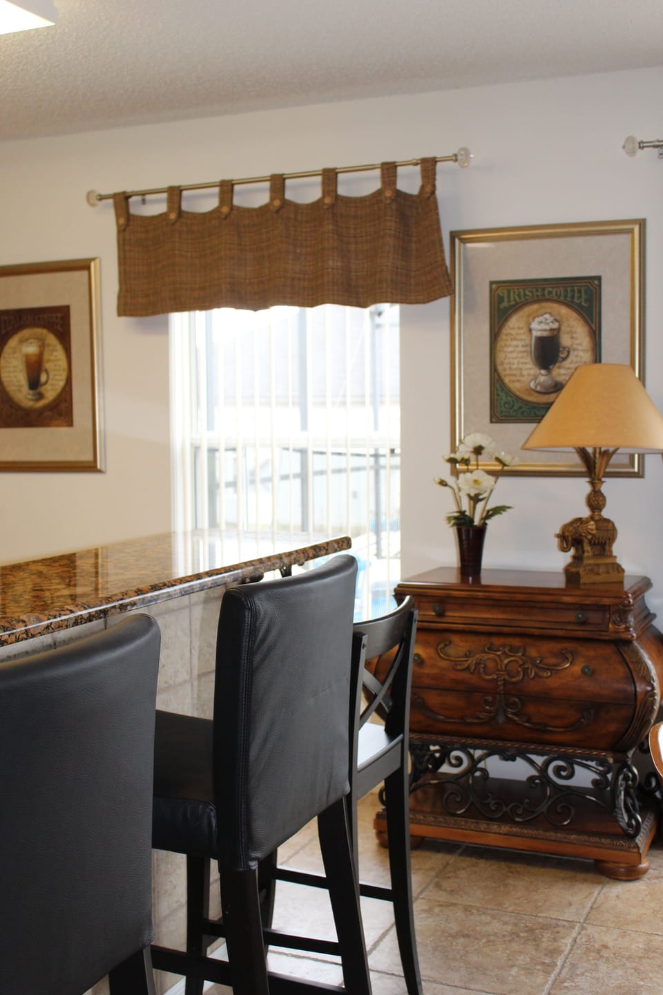 Kitchen area with high chairs/bar stools... 