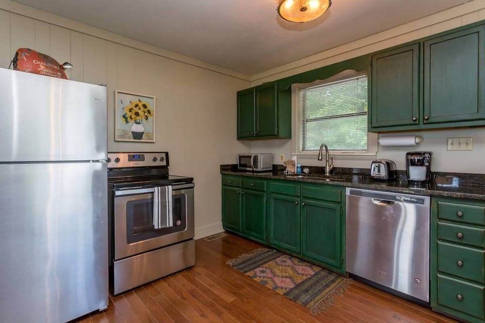 Kitchen With Stainless Appliances And Granite Countertops!