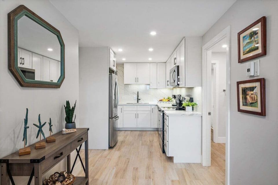Modern kitchen with white cabinets and quartz countertop