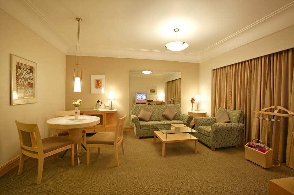 Presidential Suite | Living room | 32-inch LCD TV with satellite channels, TV, DVD player