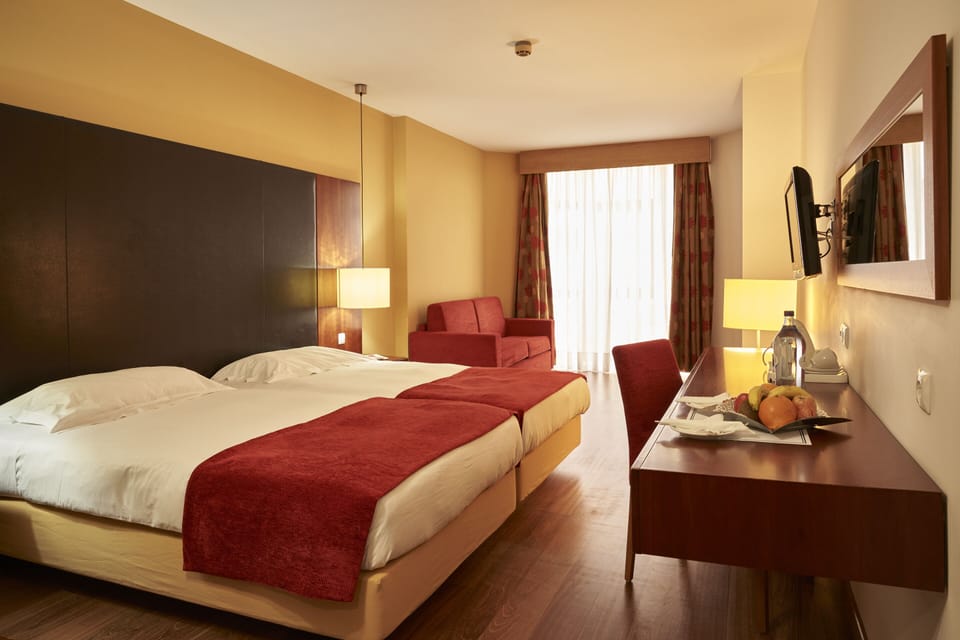 Family Room | Down comforters, minibar, in-room safe, desk