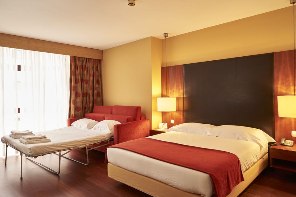 Family Room | Down comforters, minibar, in-room safe, desk