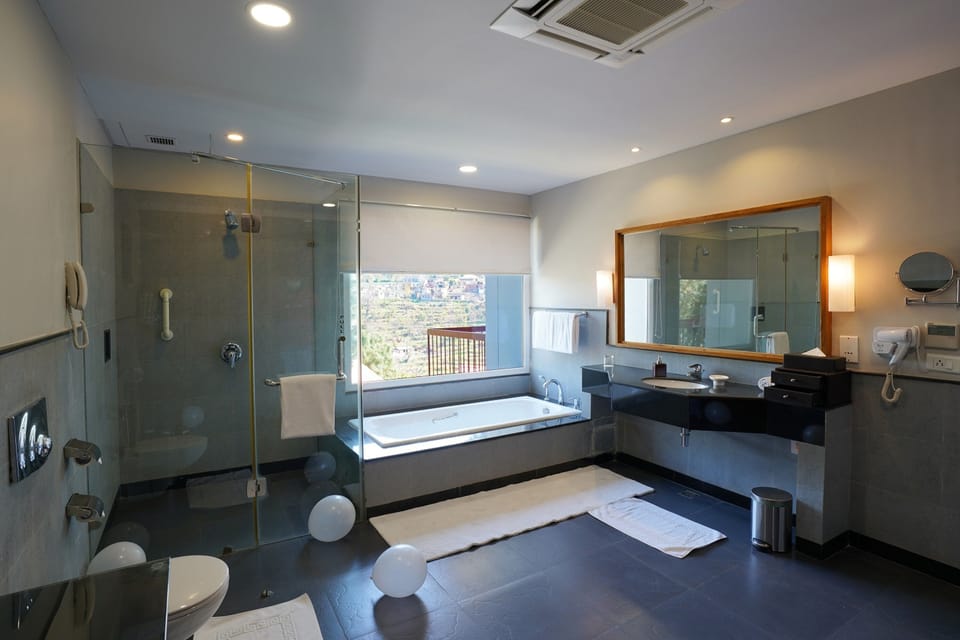 Separate tub and shower, rainfall showerhead, free toiletries