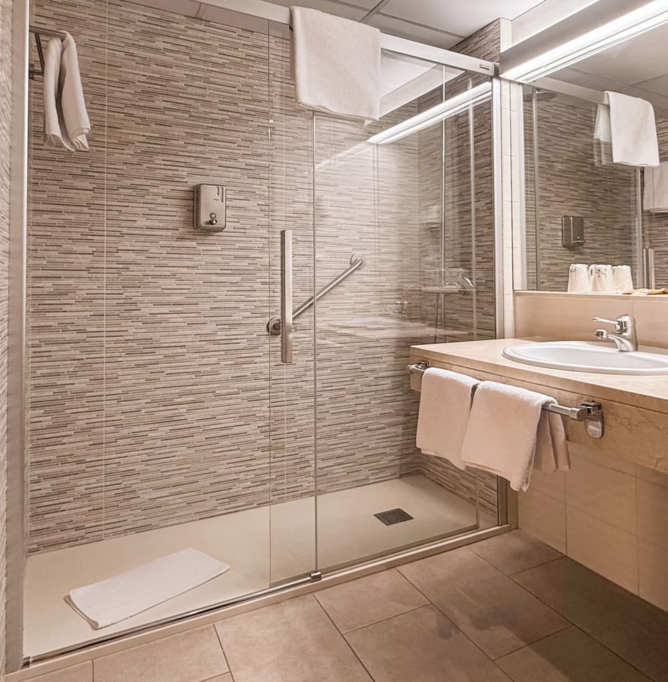 Bathtub, hair dryer, towels