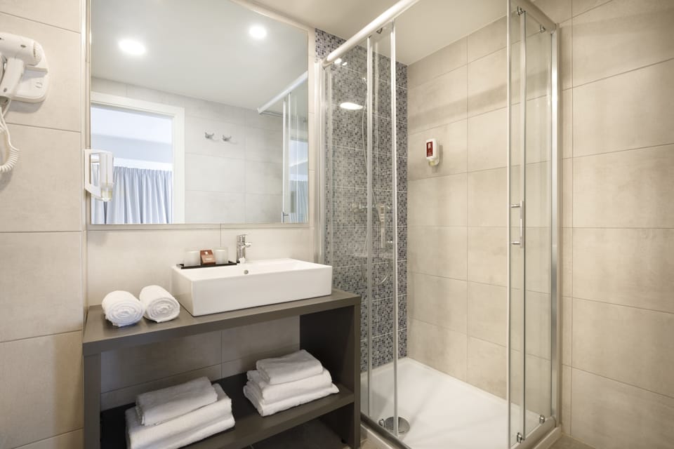 Shower, free toiletries, hair dryer, towels