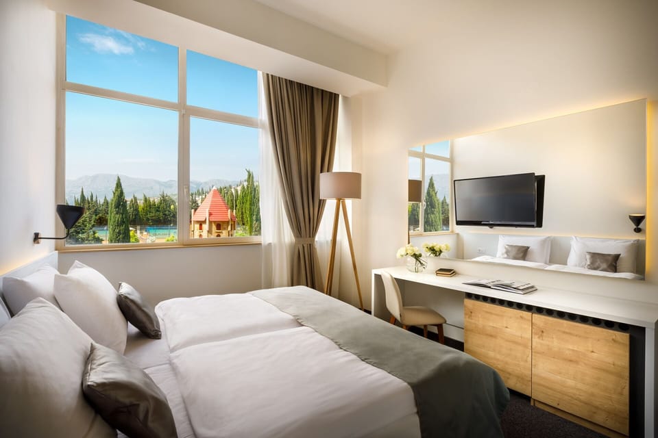 Double room with park view | Minibar, in-room safe, desk, blackout drapes