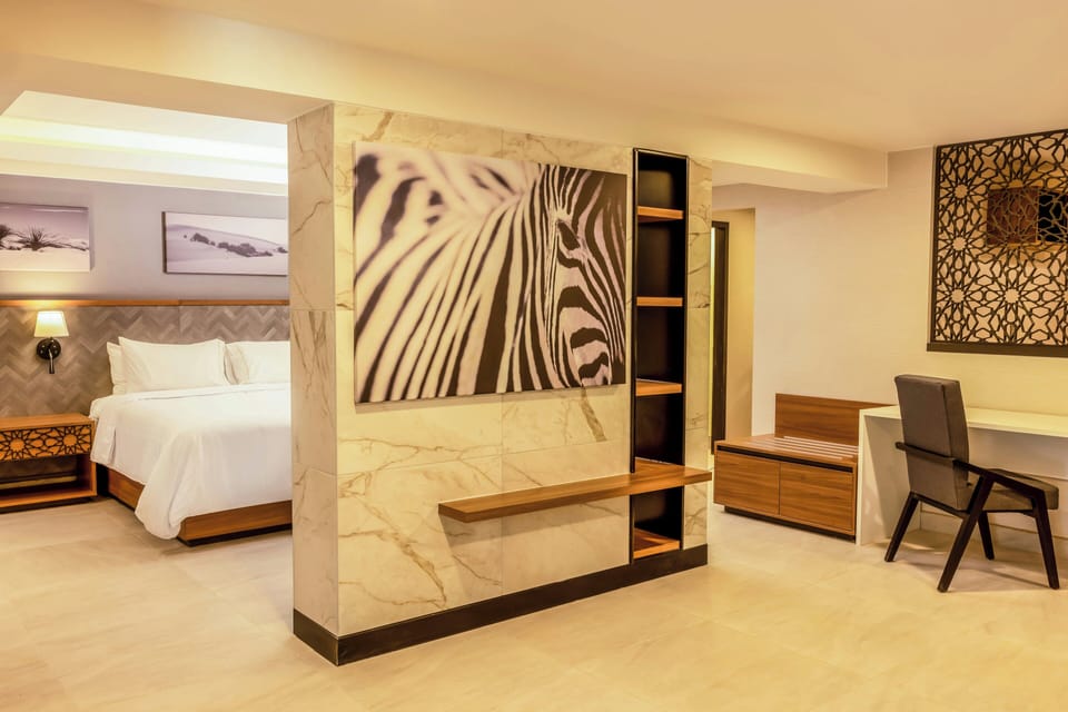 Premium bedding, down comforters, in-room safe, desk