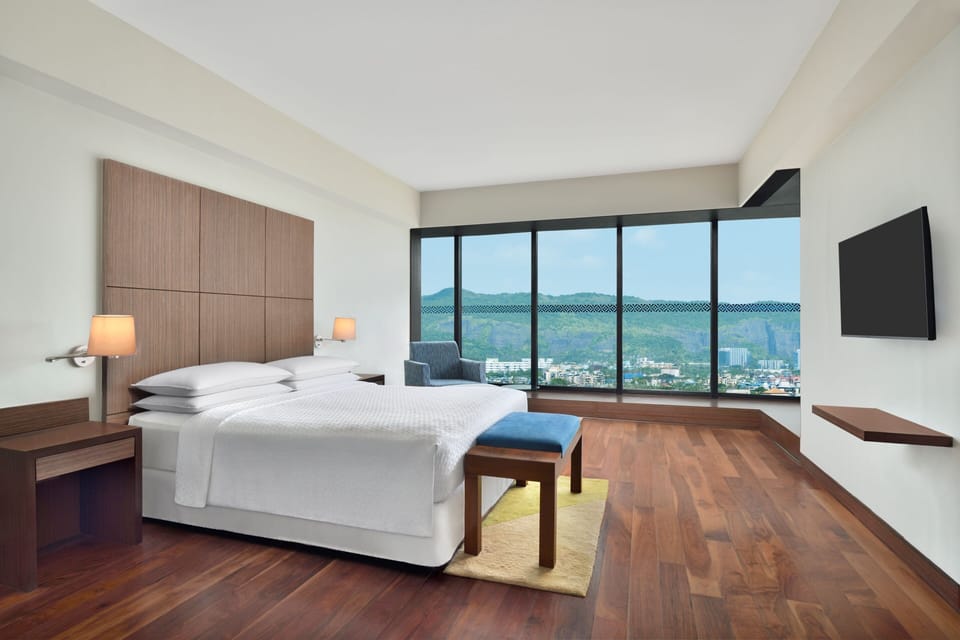 Premier Suite, 1 Bedroom, Pool View | Memory foam beds, minibar, in-room safe, desk