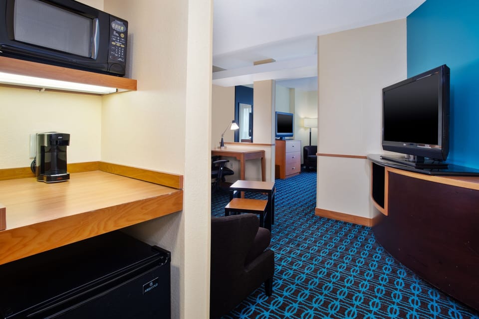 Suite, 1 King Bed with Sofa bed | Desk, laptop workspace, iron/ironing board, free cribs/infant beds