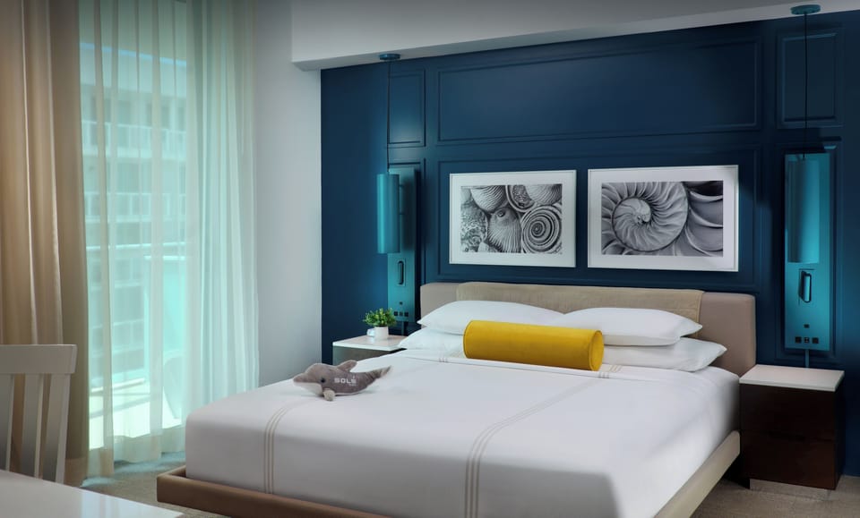 Premium bedding, down comforters, pillowtop beds, minibar