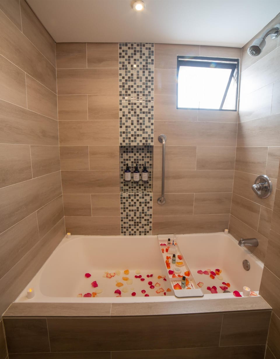Suite, One King Bed, Non-Smoking | Bathroom | Shower, free toiletries, hair dryer, bathrobes