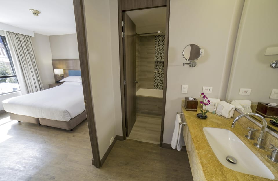 Suite, One King Bed, Non-Smoking | 1 bedroom, Egyptian cotton sheets, premium bedding, down comforters