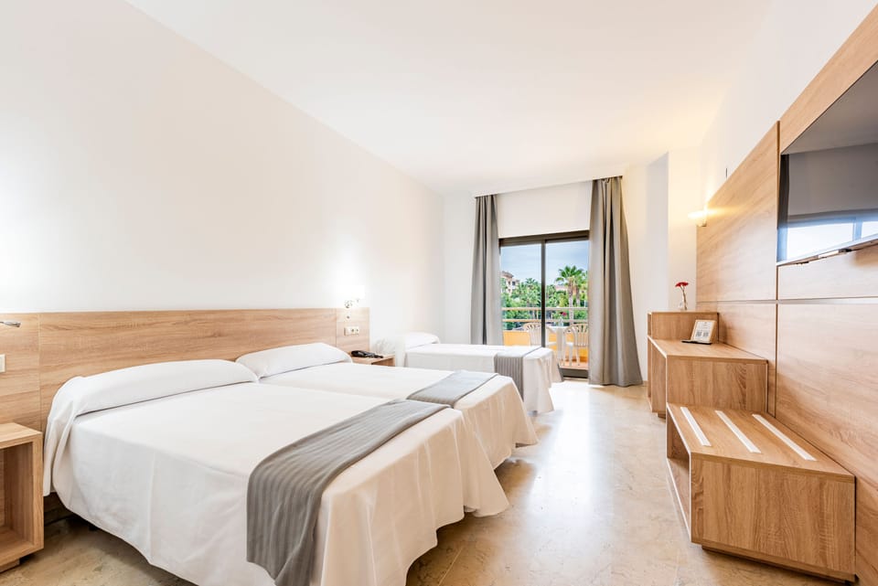 Triple Room, Terrace | Minibar, in-room safe, desk, laptop workspace