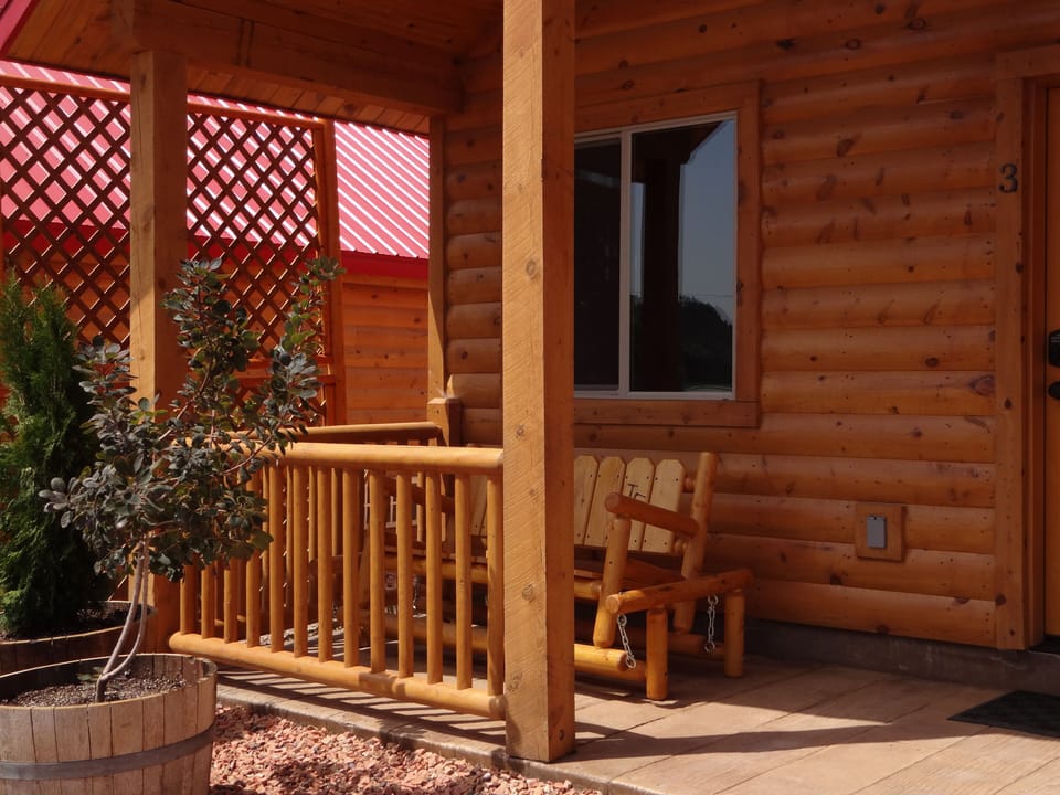 Our porch with a glider rocker swing.