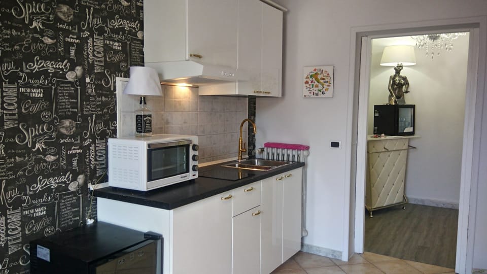 Family Double Room, City View | Private kitchenette | Fridge, coffee/tea maker, electric kettle