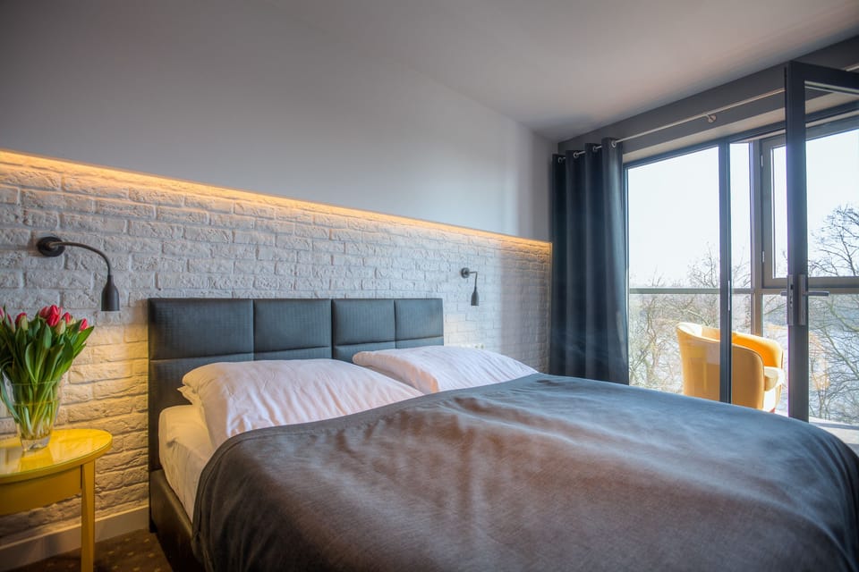 Deluxe Double Room, River View | In-room safe, desk, iron/ironing board, cribs/infant beds