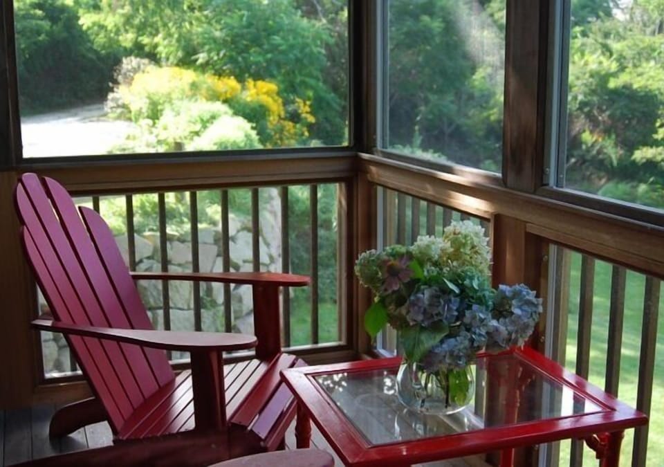 Screened in back porch over looking landscaped yard
