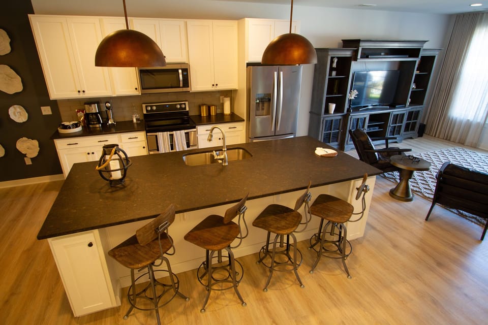 Grand island Centered on the main floor.  Lots of space to display family meals.