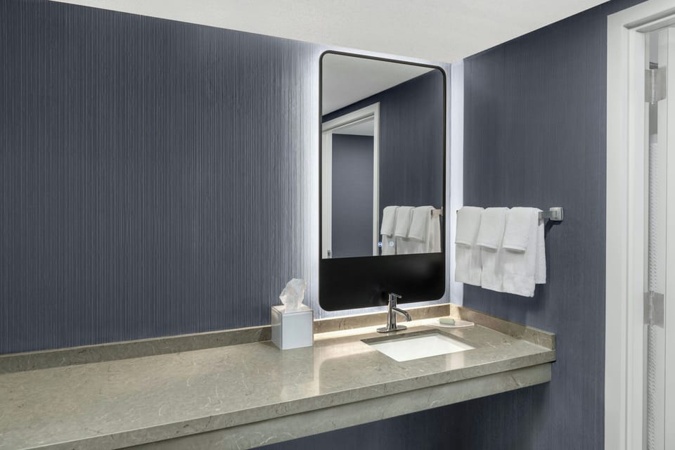 Pillowtop beds, desk, blackout drapes, iron/ironing board