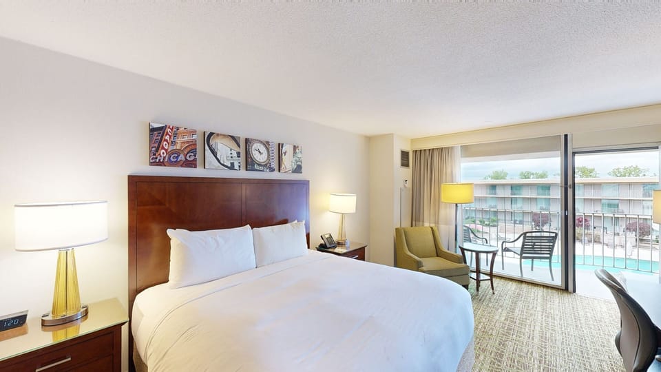 Room, 1 King Bed (Poolside) | Pillowtop beds, in-room safe, desk, laptop workspace