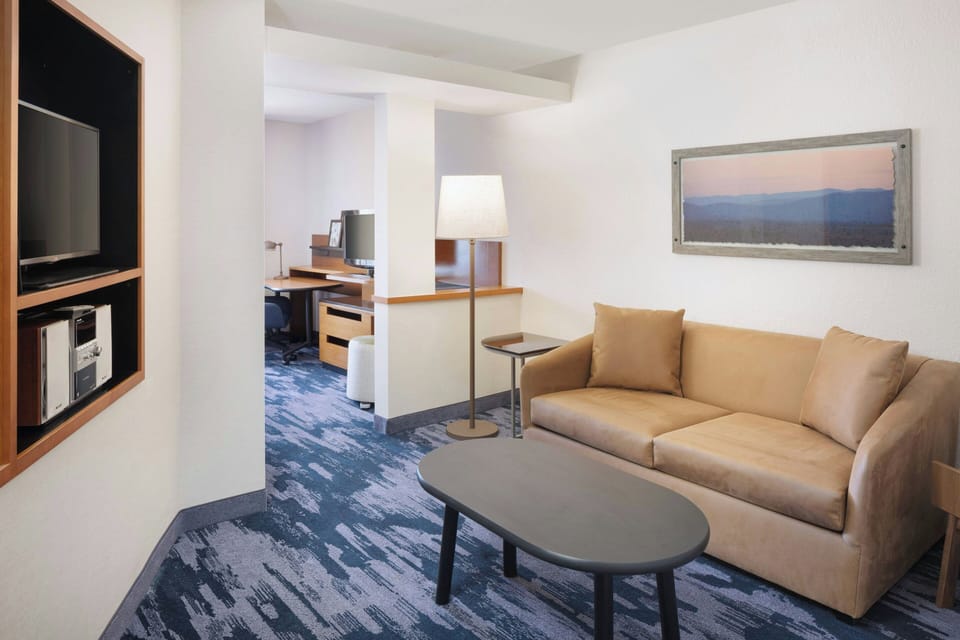 Suite, 1 King Bed with Sofa bed | Living area | 32-inch LED TV with cable channels, TV, Netflix
