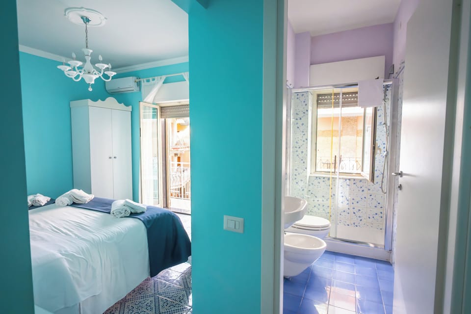 Triple Room | Minibar, in-room safe, desk, iron/ironing board