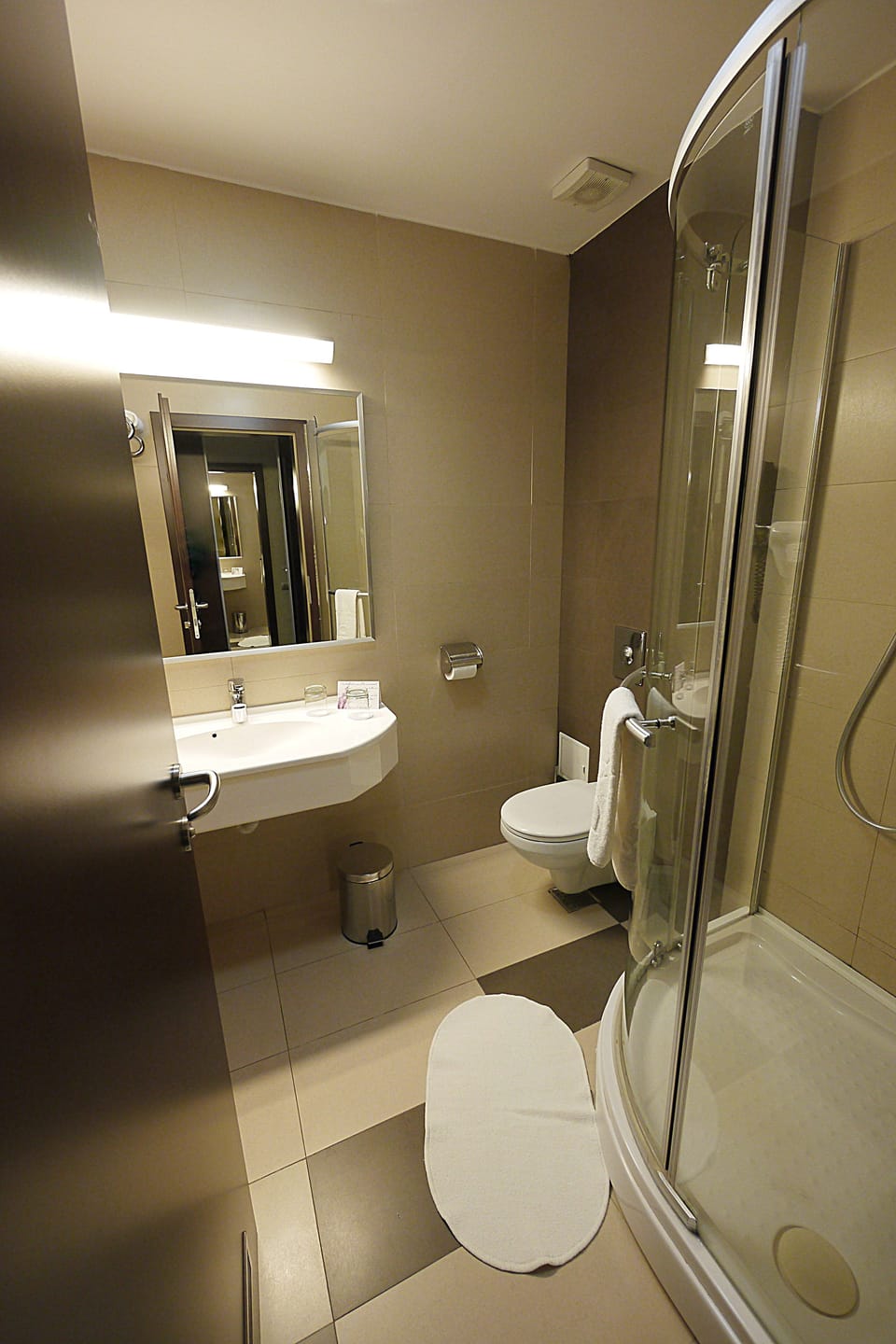 Shower, rainfall showerhead, designer toiletries, hair dryer