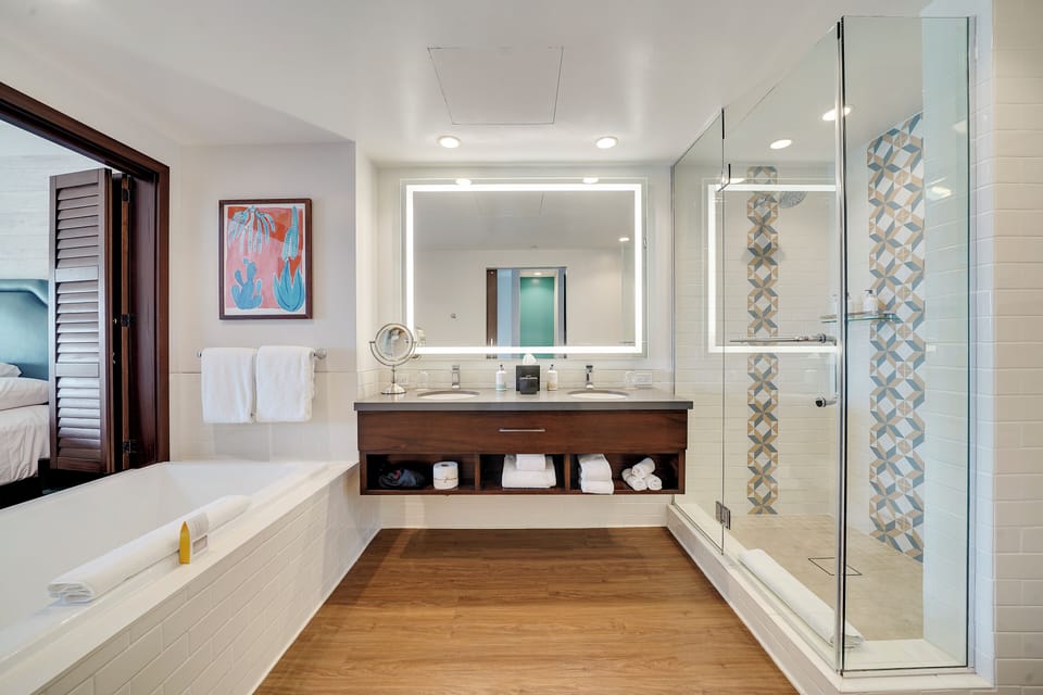 Designer toiletries, hair dryer, towels